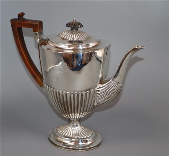 A late Victorian demi-fluted silver oval coffee pot, Charles Stuart Harris, London, 1896, gross 28 oz.